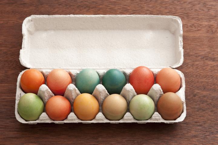 easter_egg_box.jpg - Top down view of dyed eggs in paper carton with blank underside of lid for Easter holiday theme